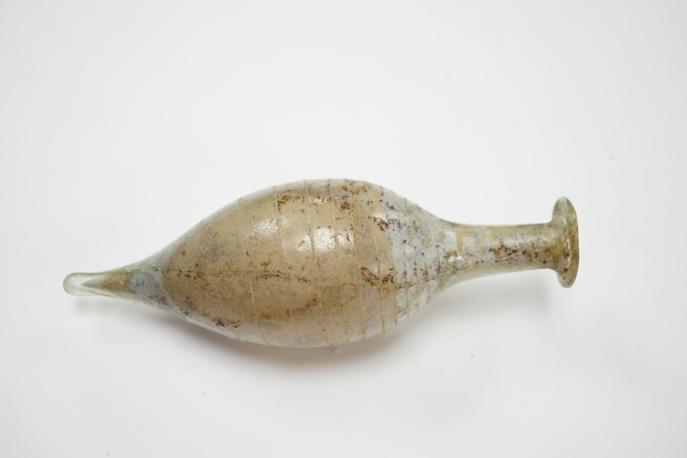 A Roman glass unguentarium, with trailed decoration, 14cm. Condition - poor, has a vertical crack from top to bottom